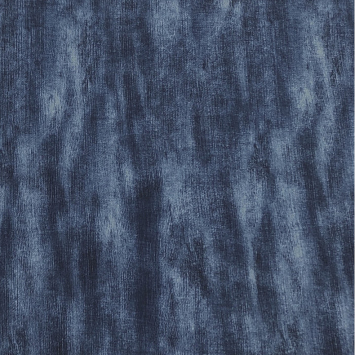 Denim color with a distressed feel on the navy blue print